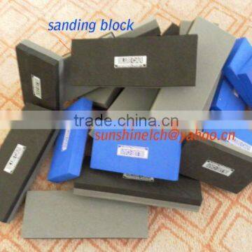 black and blue sanding blocks