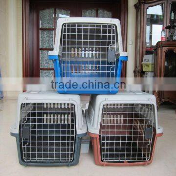 Plastic pet kennel with metal door