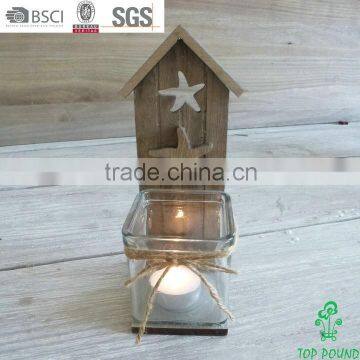 grey wooden candle holder with glass holder and carved starfishgrey wooden candle holder with glass holder and carved starfish