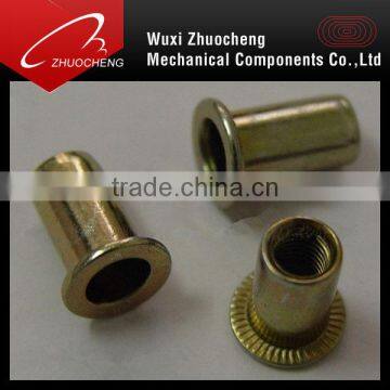 Flat head knurled body rivet nut