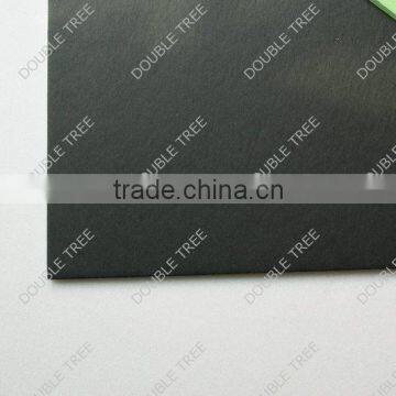 green paper on white foam