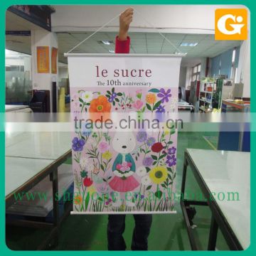 Vertical hanging banner for advertising with plastic scroll