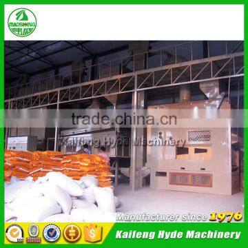 Yellow maize seed processing plant with seed treater