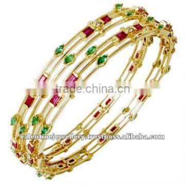 Ruby emerald gold bangle jewellery, Designer amazing gemstone bangles, Newest design gemstone gold bangle jewelry