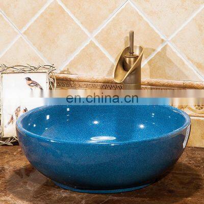 Solid color glazed ceramic wash basin of bathroom