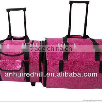 Pink PU trolley pet carrier Pink PU trolley pet carrier with wheels and a bar