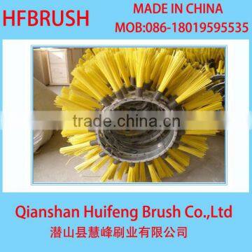 Yellow nylon sweeping brush for snow