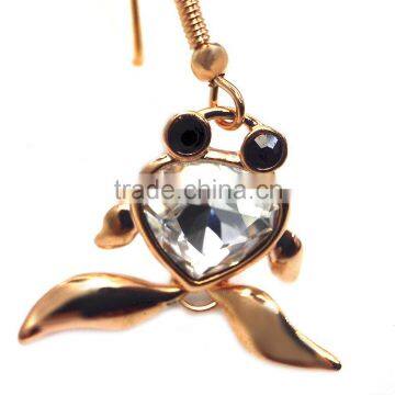 features a large crystal and two black microset crystals 18K gold earring