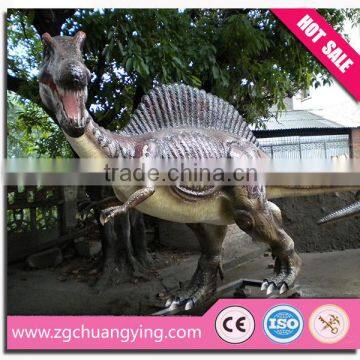 Life-size fiberglass dinosaur model in park