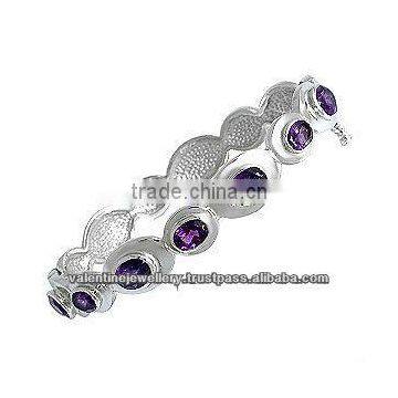 bezel set amethyst silver bracelet, heavy bracelet design, silver swirl bracelet in silver and gemstone