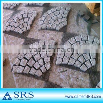 Natural split fan shaped meshed cube paver