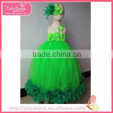 Refreshing green girl's dress decorated with flower