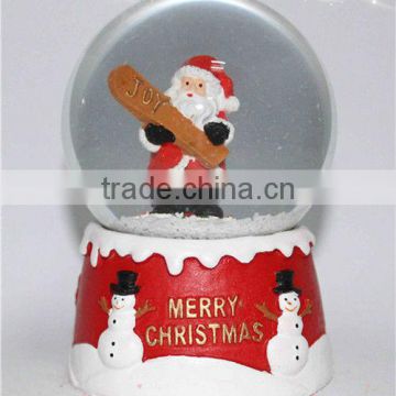 Resin santa snow globe with blowing snow