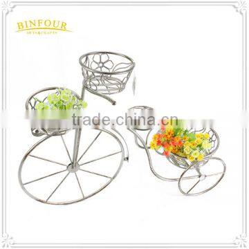 white iron bike planter holder with flower basket deco