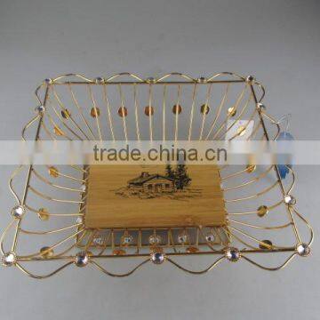 square golden iron fruit basket with wooden board