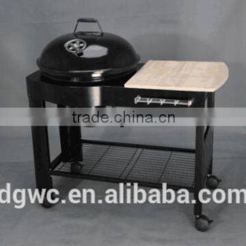 BBQ charcoal barbecue grill with wooden table