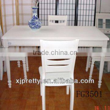 white wooden dining table with chairs