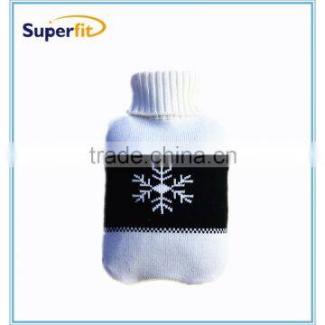 hot water bottle with black white knitted cover