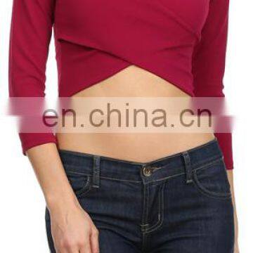 Solid color V-neck 3/4 length sleeve surplice cropped top.