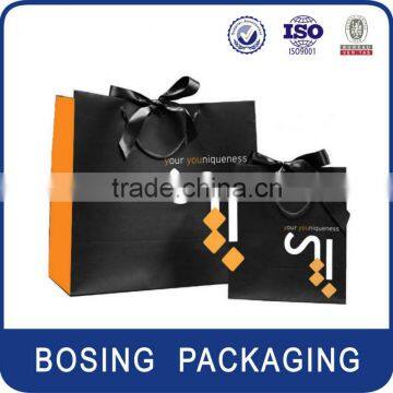 Apparel paper shopping bags with ribbon handle