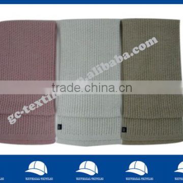 solid knitted scarf with label