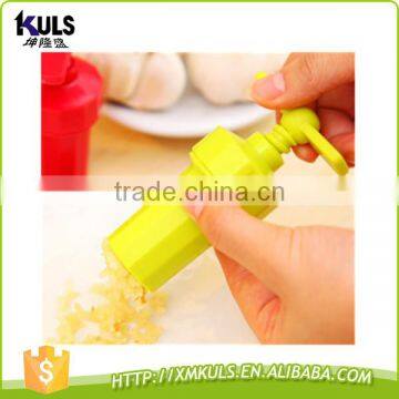 Small plastic tool for mashing garlic