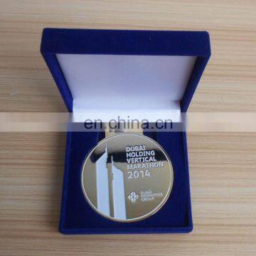 Dubai holding vetical marathon medal