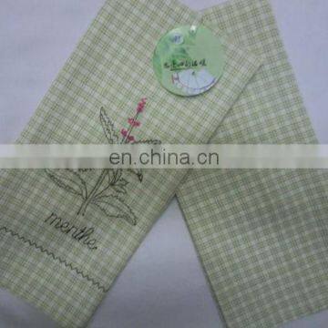 white and green small check tea towel embroidery with pattern