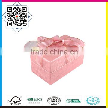 Warm pink color paper packaging box with ribbon