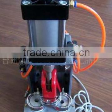 Pneumatic button making machine