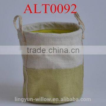 green jute bag with handles and lining inside for storage