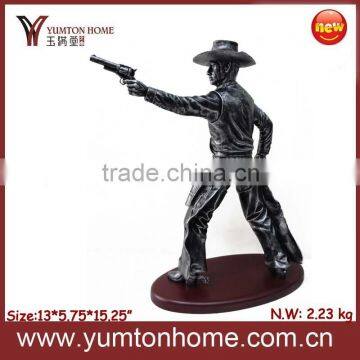 Resin West cowboy hero figurine with a gun