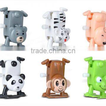 FUNNY WIND UP HANDSTAND ANIMAL CANDY TOY Y2770504