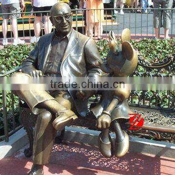 Famous Bronze Gentleman With Mickey Mouse Statue Sitting on Bench photo-2