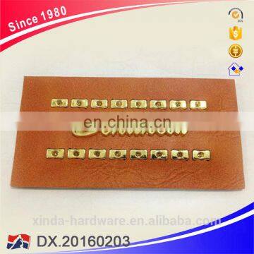 Customized Embossed fake leather label with metal for jeans