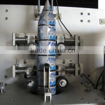 Automatic bottle label shrinking machine