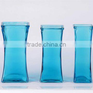 square glass vase with spray