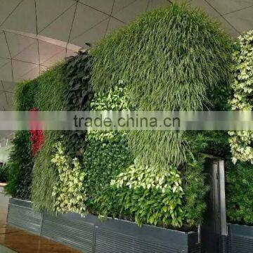 EST 10015 faux plant long grass wall coloured artificial green wall setting