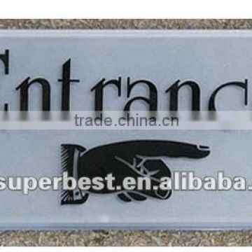 white acrylic signboard with logo printed for entrance