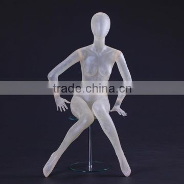 abstract plastic female mannequin, transparent sitting mannequin