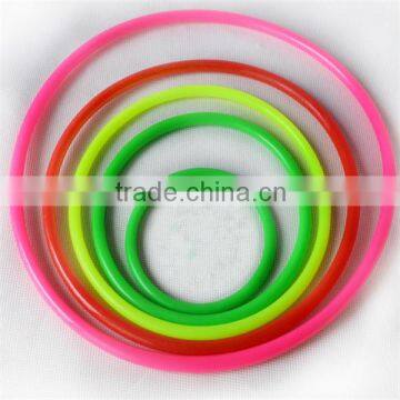 Red , green , blue , pink , blue , yellow plastic game rings