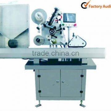 Horizontal self-adhesive labeling machine