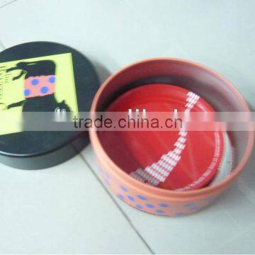 Four tin coaster sets in round tin