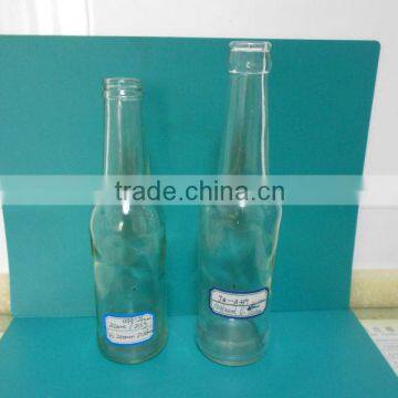 clear glass beer bottle with crown cap