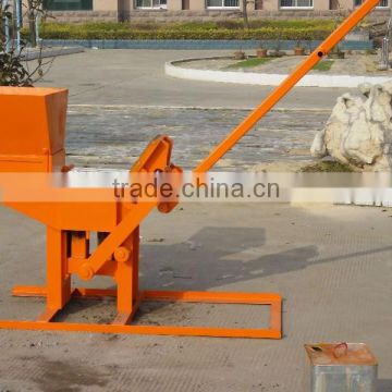 Easy operation small scale manual brick machine QMR1-40 clay interlocking brick machine in Ghana