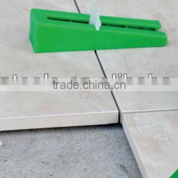 Tile Leveling System, Lippage leveling spacer and cap wedges