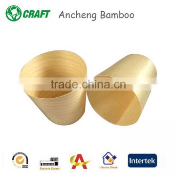 A one-time bamboo or disposable wood cup with 6cm