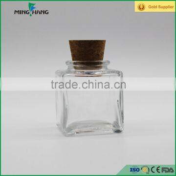 empty square glass food storage jar with cork