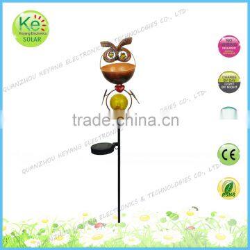 Metal animal head with a glass ball court solar light stake