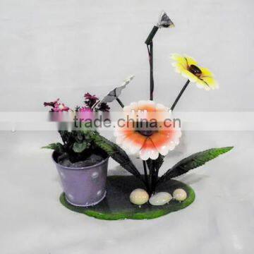 Colorful metal flowers planter with bicycle